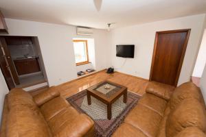 a living room with a couch and a coffee table at Apartments with WiFi Split - 12523 in Split