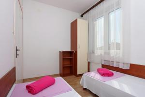 Postel nebo postele na pokoji v ubytování Apartment Crikvenica 12592c