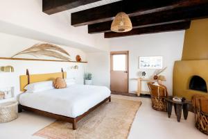 a bedroom with a bed and a fireplace at The JTH Tucson in Tucson +50 photos