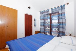 Posteľ alebo postele v izbe v ubytovaní Studio Prizba 12648d