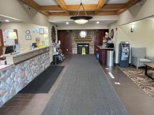 a lobby of a convenience store with a counter and a unintention at White Pine Lodge in Salamanca