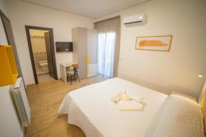 Posteľ alebo postele v izbe v ubytovaní Medoro Camere Milazzo