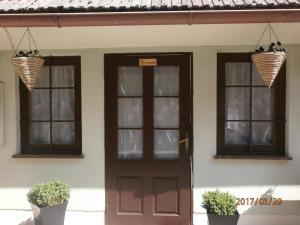 a house with two windows and a door at Apartments with a parking space Samobor, Prigorje - 12869 in Samobor