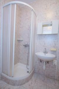 a bathroom with a shower and a sink at Apartments by the sea Rogoznica - 12995 in Rogoznica