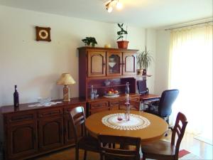 a dining room with a table and a desk at Apartments with a parking space Liznjan, Medulin - 13009 in Ližnjan