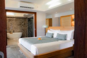 Amnaya Resort Nusa Dua客房内的一张或多张床位