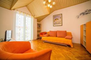 a living room with a couch and two chairs at Apartments with parking space Bol, Brac - 12980 in Bol