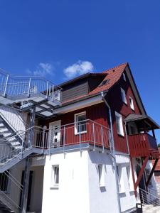 a building with stairs on the side of it at Lamm - Wohnung 2 in Spiegelberg