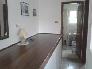 a room with a table with a lamp on it at Apartments with a parking space Liznjan, Medulin - 13164 in Ližnjan
