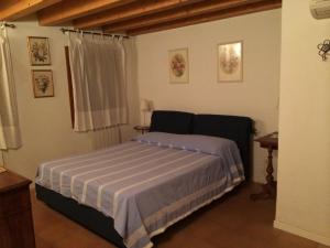 Łóżko lub łóżka w pokoju w obiekcie Villa Pastori