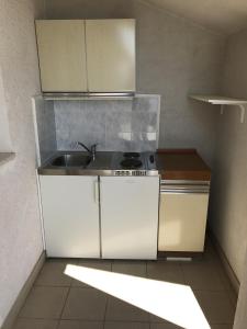 a kitchen with a sink and a stove at Studio Gradac 13179b in Gradac