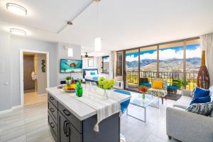 a kitchen and living room with a view at Tropical Retreat Near Waikiki Beach with Parking in Honolulu