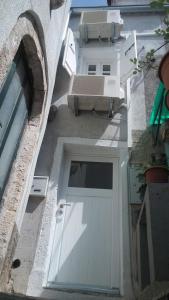 an overhead view of a white garage door in a building at Apartments by the sea Cres - 13510 in Cres