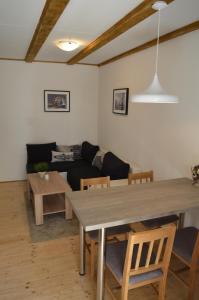 a living room with a table and a couch at Apartments by the sea Cres - 13510 in Cres