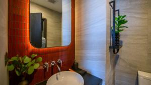 a bathroom with a sink and a mirror at EDGE Central pattaya near walking street in Pattaya Central +111 photos