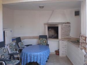 a kitchen with a table and chairs in a room at Apartments by the sea Brna, Korcula - 13618 in Smokvica