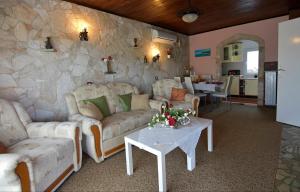 a living room with two couches and a table at Apartments with parking space Savudrija, Umag - 13589 in Savudrija