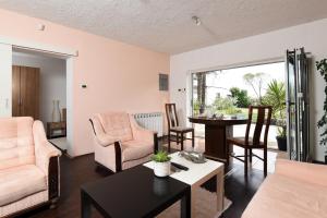 a living room with a table and chairs at Apartments with a swimming pool Kastav, Opatija - 13638 in Kastav