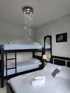 Postel nebo postele na pokoji v ubytování CASABOUTIQUE HOTEL