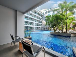 a view of a swimming pool in a building at The Kee Resort & Spa in Patong Beach