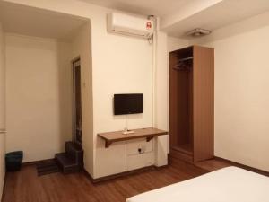 TV a/nebo společenská místnost v ubytování I Harmony Hotel