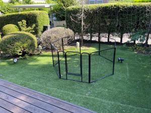 a batting cage in a yard with a tree at KandoStay 伊豆高原パークガーデン in Ito