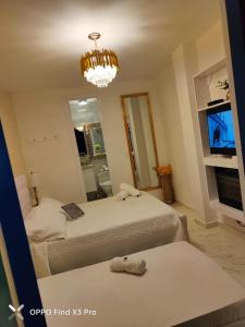 Postel nebo postele na pokoji v ubytování CASABOUTIQUE HOTEL