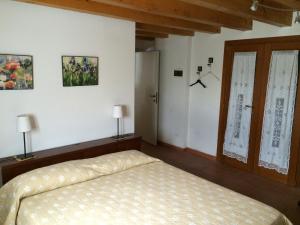 Łóżko lub łóżka w pokoju w obiekcie Villa Pastori