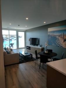a living room with a couch and a table at Apartment 3 Wallaroo Marina in Wallaroo