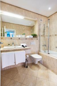 a bathroom with a toilet and a shower and a sink at Apartments and rooms with WiFi Zagreb - 14675 in Zagreb