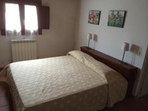 Łóżko lub łóżka w pokoju w obiekcie Villa Pastori