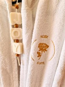 a white towel with a frog on it at Rose Suite in Caesarea