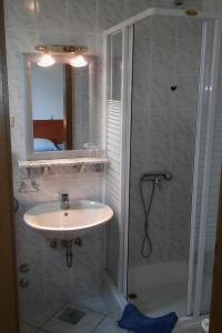 a bathroom with a sink and a shower at Apartments and rooms by the sea Stanici, Omis - 14782 in Omiš +48 photos