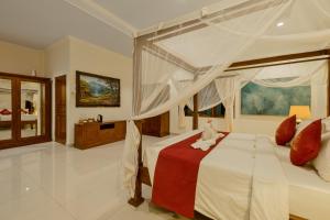 Postel nebo postele na pokoji v ubytování Gora House Bali
