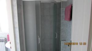 a shower with a glass door in a bathroom at Rooms with a parking space Zagreb - 14837 in Zagreb