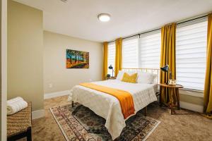 a bedroom with a large bed and a window at Happy Halliday-6 Min from Downtown San Antonio,TX in San Antonio