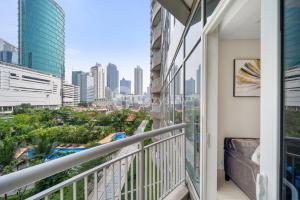 a balcony with a view of the city at Ebony by Kozystay - Setiabudi in Jakarta