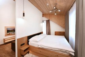 Posteľ alebo postele v izbe v ubytovaní APLEND Hotel Ovruč