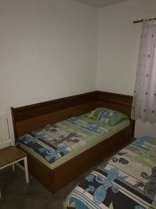 Postel nebo postele na pokoji v ubytování Apartment Sukosan 14970d + 11 fotografií