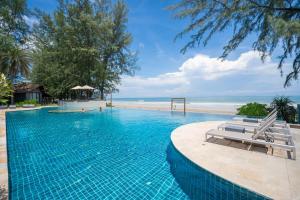 a beach with a pool and a pool table at Twin Lotus Resort and Spa - SHA Plus in Ko Lanta