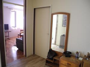 a hallway with a mirror and a living room at Apartments with WiFi Split - 15028 in Split