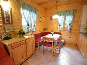a dining room with a table and chairs in a cabin at Holiday house with a parking space Crni Lug, Gorski kotar - 15058 in Crni Lug