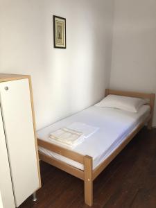 a small bed in a room with a mirror at Secluded fisherman's cottage Cove Srhov Dolac, Hvar - 15087 in Gdinj
