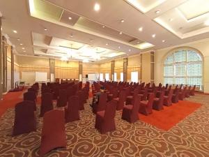 a large room with rows of chairs in it at Al Azhar Azhima Hotel Resort and Convention in Solo