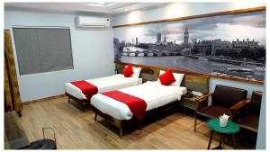 Annandam Inn(Hotel Anand)客房内的一张或多张床位