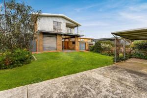 an image of a house with a yard at Views on Broadway in San Remo