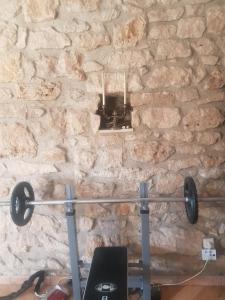a barbell in front of a stone wall at Van Helsing in Esch-sur-Alzette