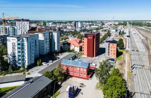 an aerial view of a city with tall buildings at Hotelli-Ravintola Alma in Seinäjoki
