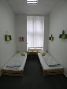 Postel nebo postele na pokoji v ubytování ApartHostel Brno