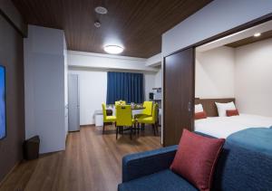 Postel nebo postele na pokoji v ubytování Ryujin Hotel Ukishima